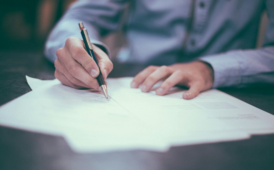 Hand signing a document